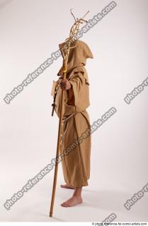 03 2019 01 JOEL ADAMSON MONK STANDING POSE WITH A…